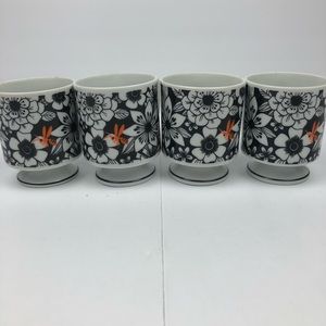 Four Black White & Orange Mod floral pedestal mug